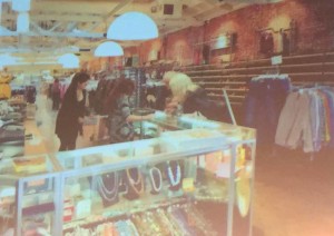 Photo from Reeves' slide show presentation: This thrift store has created an inviting place to show through exposed brick, high ceilings and natural lighting.